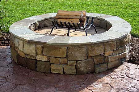 Outdoor fireplace and masonry by JRK Builders